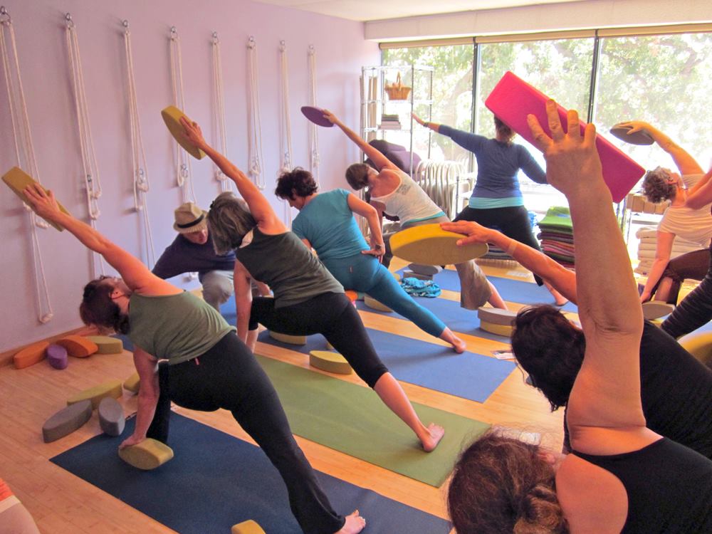 Yoga Class in Extended Side Angle Pose at Yoga Upstair Agoura Hills, CA